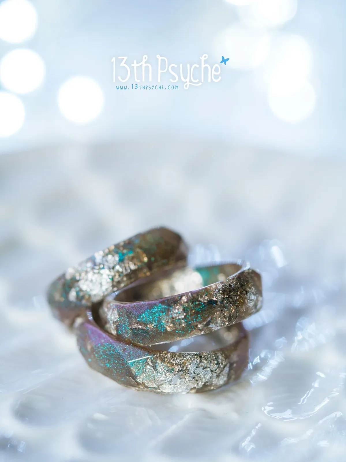 Iridescent grey faceted resin ring with silver flakes