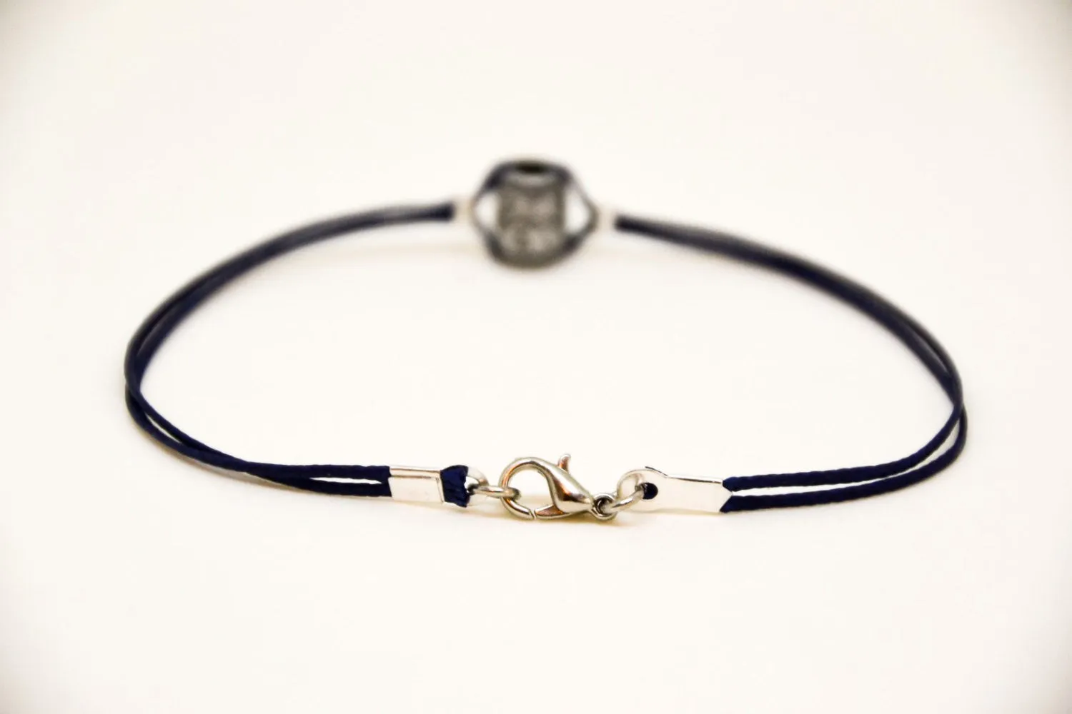 Silver tube bracelet for men, blue cord